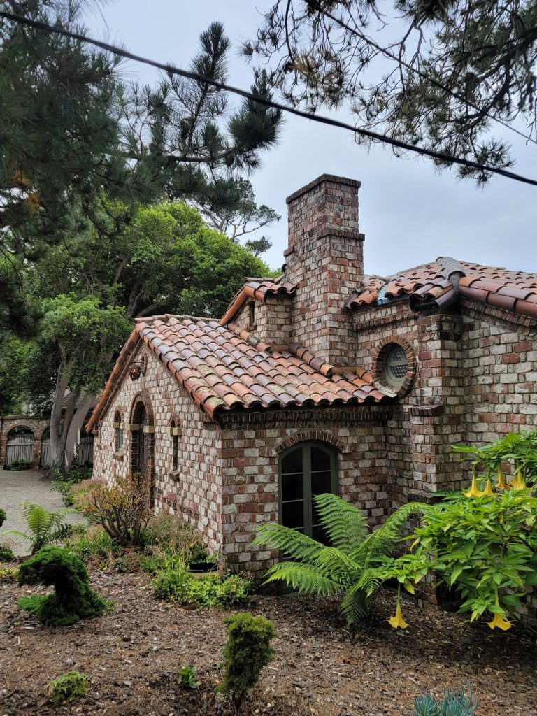 Contemporary photograph of Charles Greene Carmel House and Studio showing brick studio and redwood bungalow built with recycled materials in Carmel-by-the-Sea