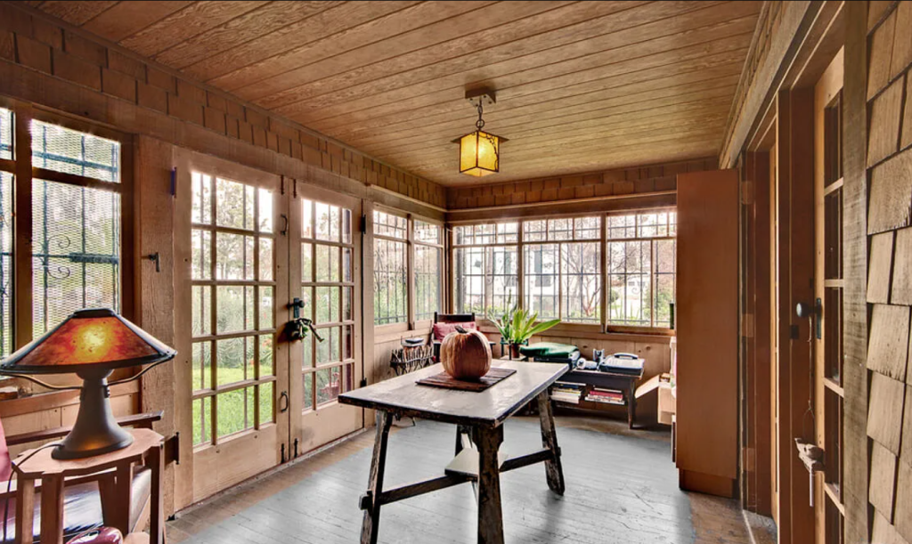 A photograph of the back porch of the Miss Lucy E. Wheeler House, showing a sheltered outdoor living space.