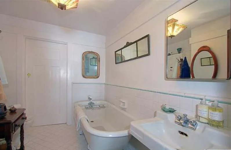 Gallery of six photographs showing the upstairs spaces of the Josephine van Rossem House No. 2 (1904) by Greene & Greene, including bathroom, four bedrooms with period furnishings and distinctive color schemes, and upstairs hallway with wood trim and built-in features, demonstrating the California House concept's comprehensive interior planning in Pasadena, California.