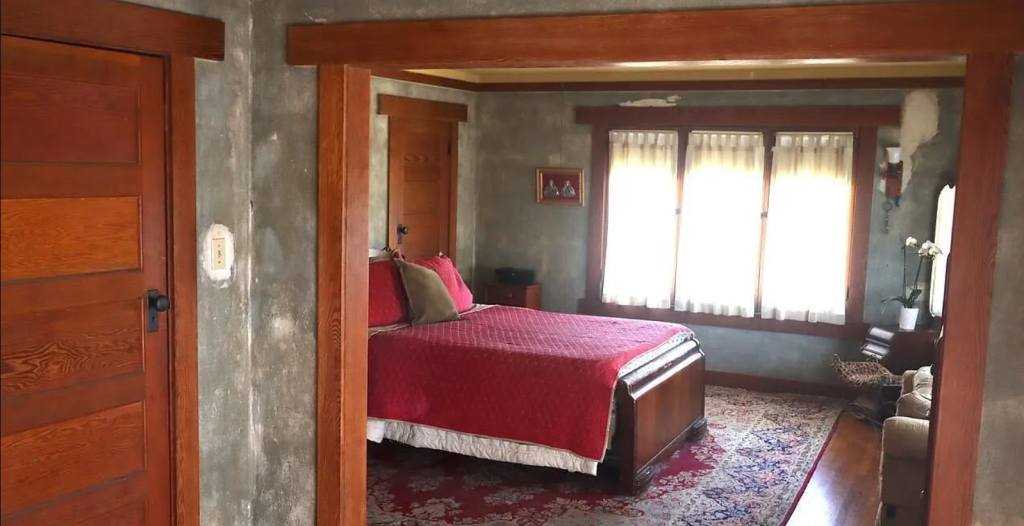 An alternate photograph of the master bedroom of the Miss Lucy E. Wheeler House, showing its spaciousness and light.