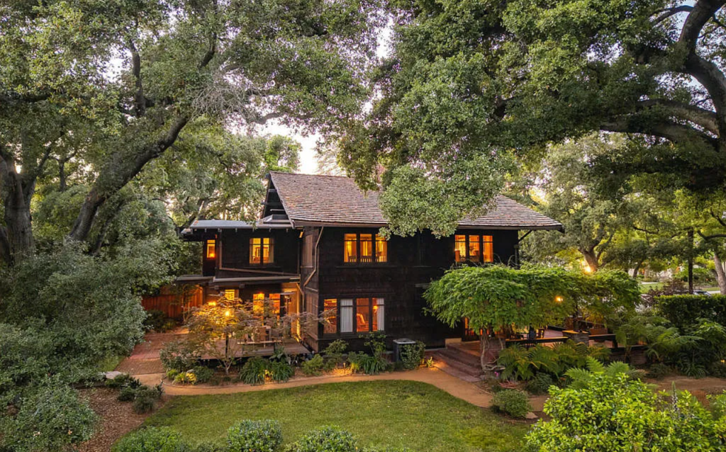 Alternate distant sideyard view of the Louise C. Bentz House showing full structure, landscaping, and architectural details