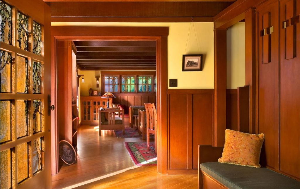 Entry hall interior of Mary L. Darling House showing exposed ceiling beams, natural wood finishes, and Arts and Crafts interior design by Greene & Greene, 1903.