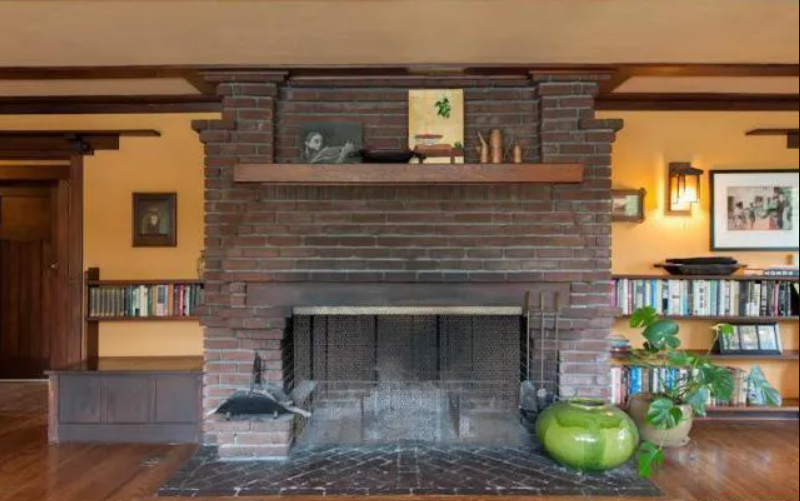 A detailed shot of the brickwork and mantel of the fireplace in the Louise T. Halsted House.