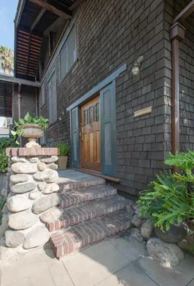 A close-up of the brick steps and walkway leading to the front door of the Louise T. Halsted House.
