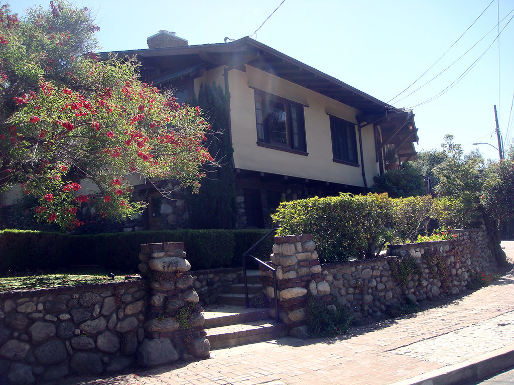 Contemporary front entrance view of Martha, Violet and Jane White House showing boulder stone retaining walls, entrance steps, and Arts and Crafts integration with landscape by Greene & Greene, 1903.