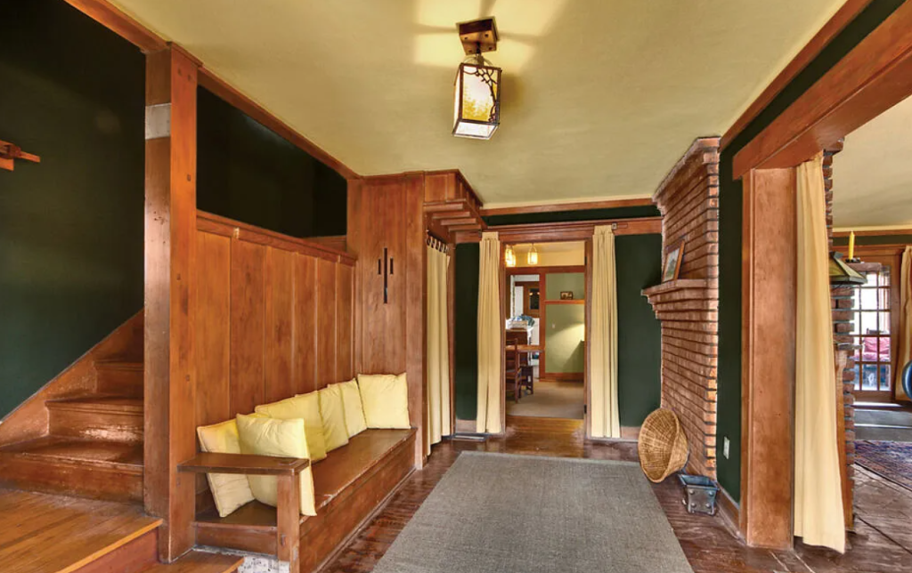 An alternate photograph of the front entryway of the Miss Lucy E. Wheeler House, highlighting the woodwork and joinery.