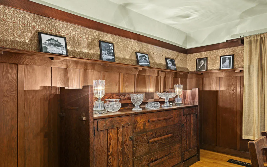 Dining room sideboard in the Louise C. Bentz House with built-in cabinetry, wood construction, and period hardware