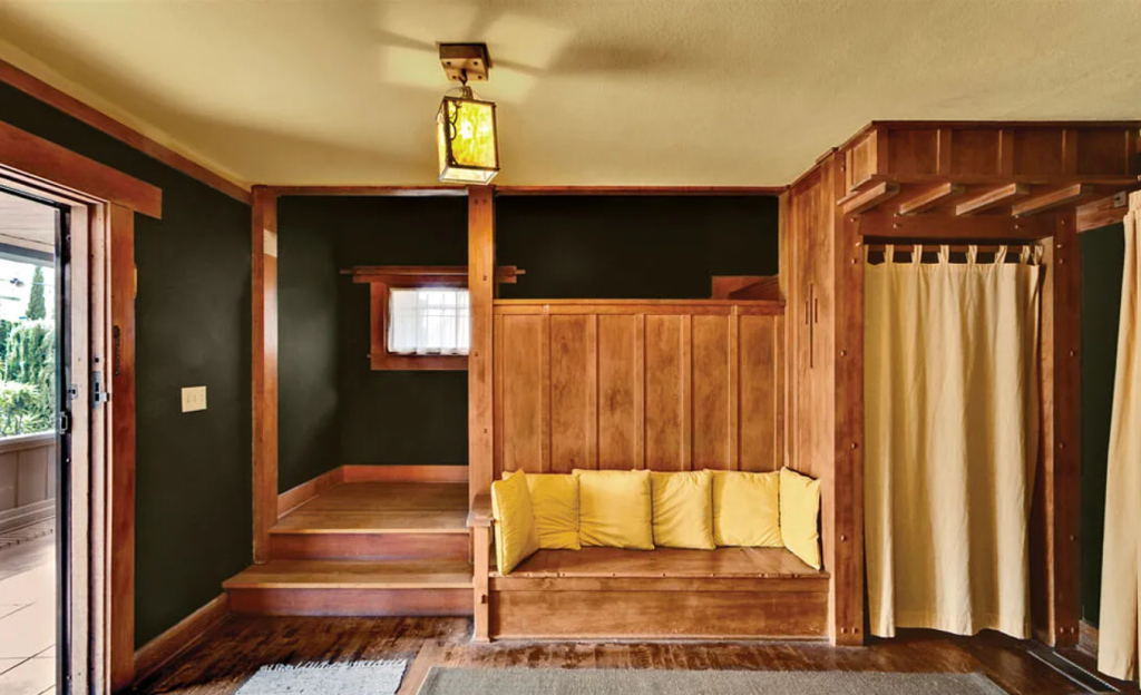 A photograph of the front entryway of the Miss Lucy E. Wheeler House, showing its wood paneling and light fixtures.