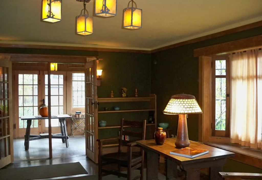 An alternate photograph of the living room of the Miss Lucy E. Wheeler House, showing its open plan and large windows.