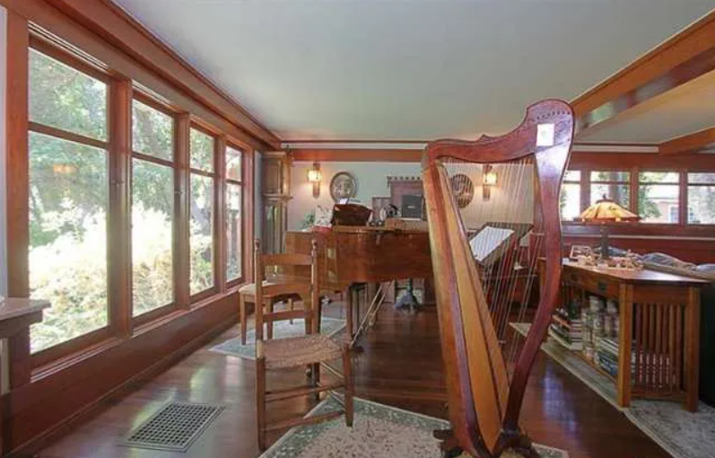 Gallery of six interior photographs showing the Josephine van Rossem House No. 2 (1904) by Greene & Greene, including dining room, fireplace area, kitchen, living room, stairway, and sun room, demonstrating the California House concept's interior planning, authentic woodwork, and indoor-outdoor living integration in Pasadena, California.