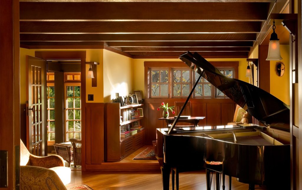 Piano room interior of Mary L. Darling House showing exposed ceiling beams, natural wood finishes, and specialized Arts and Crafts room design by Greene & Greene, 1903.