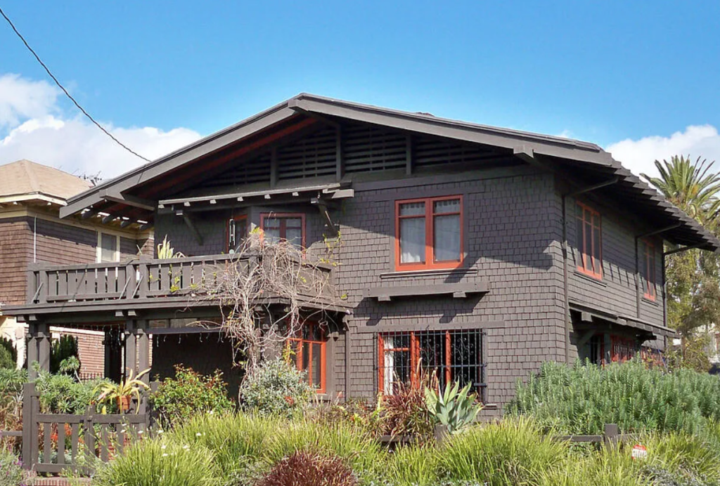 A contemporary photograph of the front of the Miss Lucy E. Wheeler House, showing its restored redwood shingle exterior.