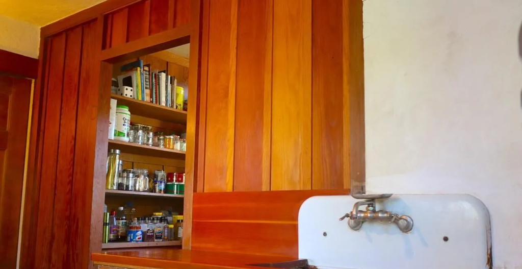 A photograph of the pantry of the Miss Lucy E. Wheeler House, showing its custom shelves and cabinets.
