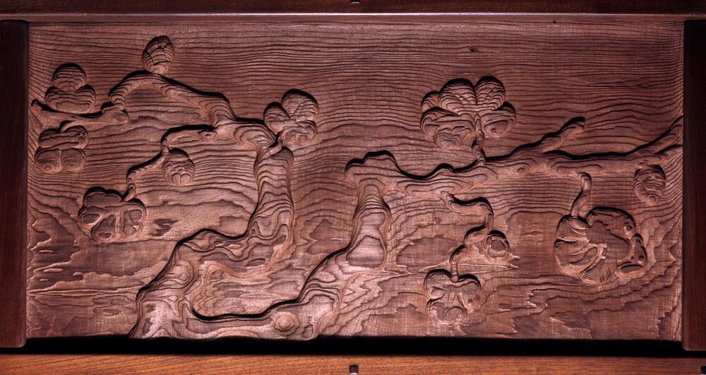 Frieze panel showing oak branches with detailed leaves and acorns in naturalistic earth tones. The composition demonstrates Japanese-influenced design with asymmetrical branch placement and careful attention to botanical detail, painted against a neutral background.
