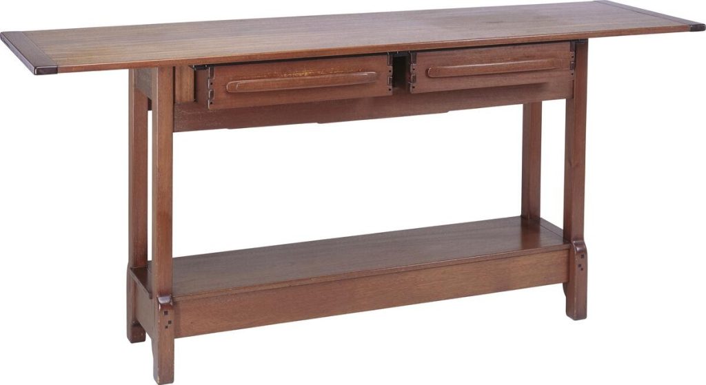 Hall side table in Honduras mahogany with elongated top and lower shelf. Features two drawers with horizontal pulls, cloud-lift bracket details on legs, extensive visible pegging, and refined proportions. Demonstrates Japanese-influenced design with emphasis on horizontal lines and structural expression.
