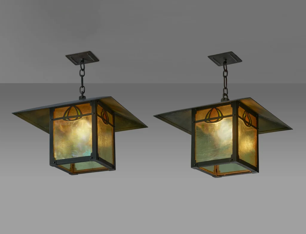 Modern color photograph of a pair of custom-designed lanterns from the Freeman A. Ford House, featuring leaded glass and patinated bronze.