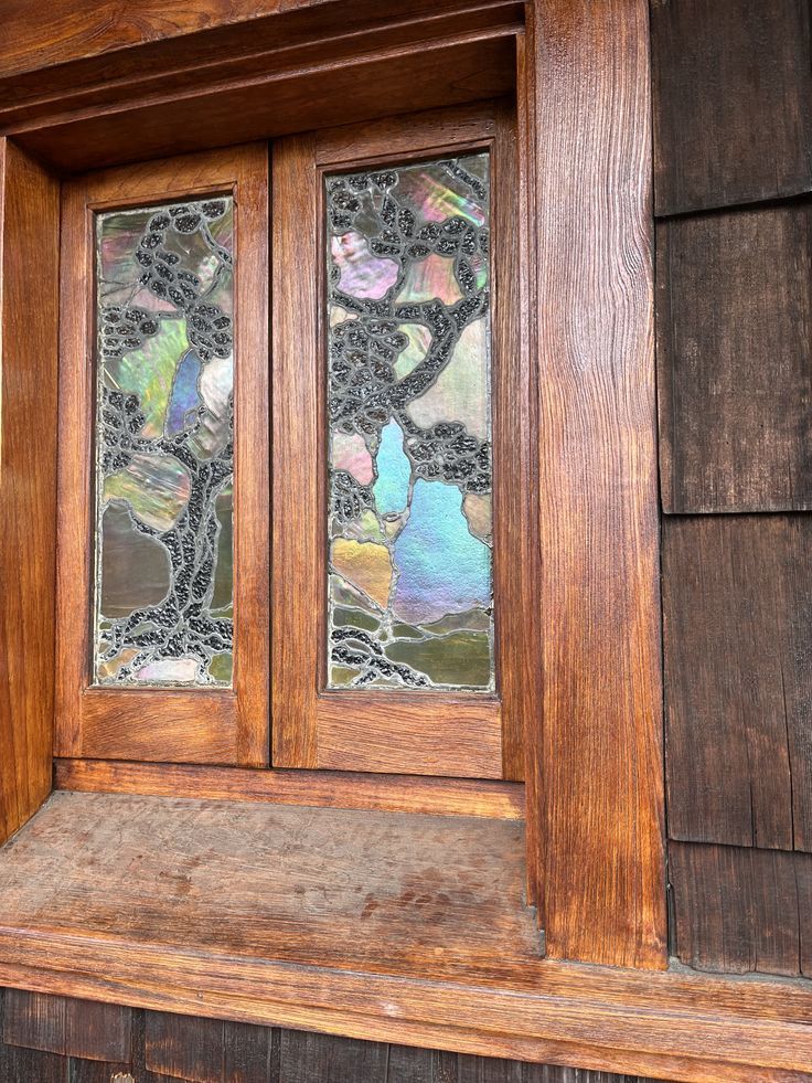 Thorsen House art glass window panels with cloud lift pattern, iridescent glass, and quartersawn oak timber frame