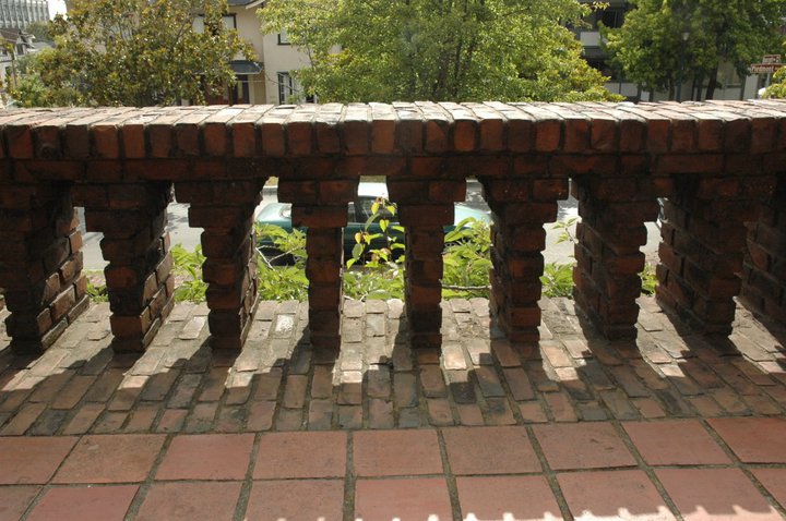 Clinker brick landing at Thorsen House entrance with decorative corbeled balustrade and brick paver pattern