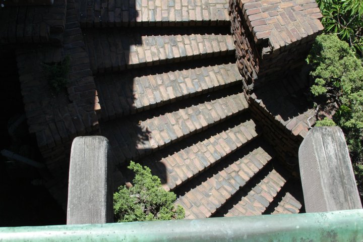 Aerial view of Thorsen House brick entrance stairs showing clinker brick treads, retaining walls, and timber posts