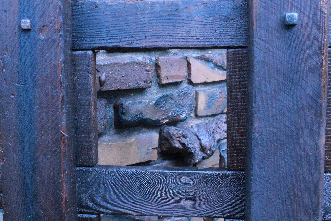 Detail of a clinker brick gate pier at the Thorsen House in Berkeley, built of irregular over-fired bricks combined with smooth rounded river stones