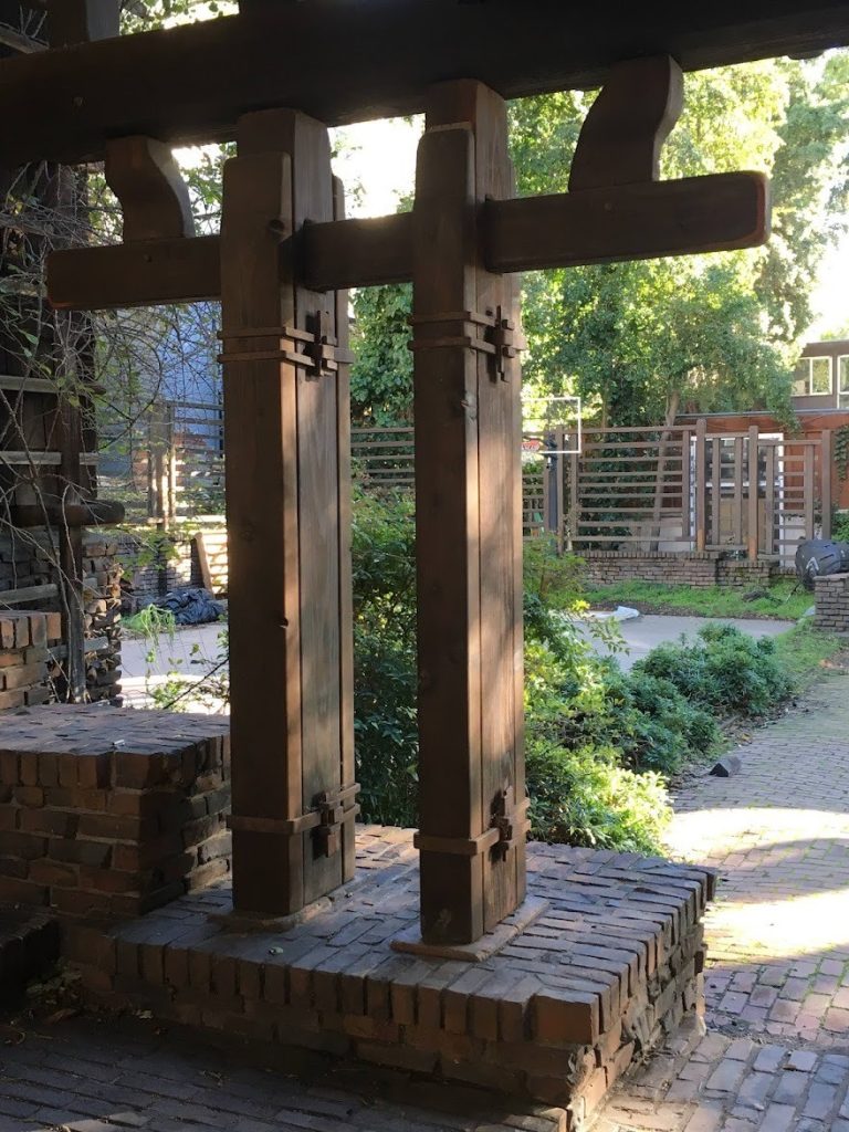 Temporary shoring supports under Thorsen House sun deck showing preservation challenges and structural reinforcement