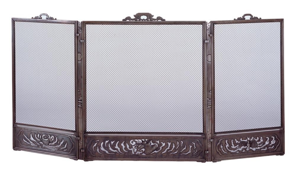 Greene & Greene living room fireplace screen for Thorsen House with mesh panels, cast iron frame, and trailing vine motifs
