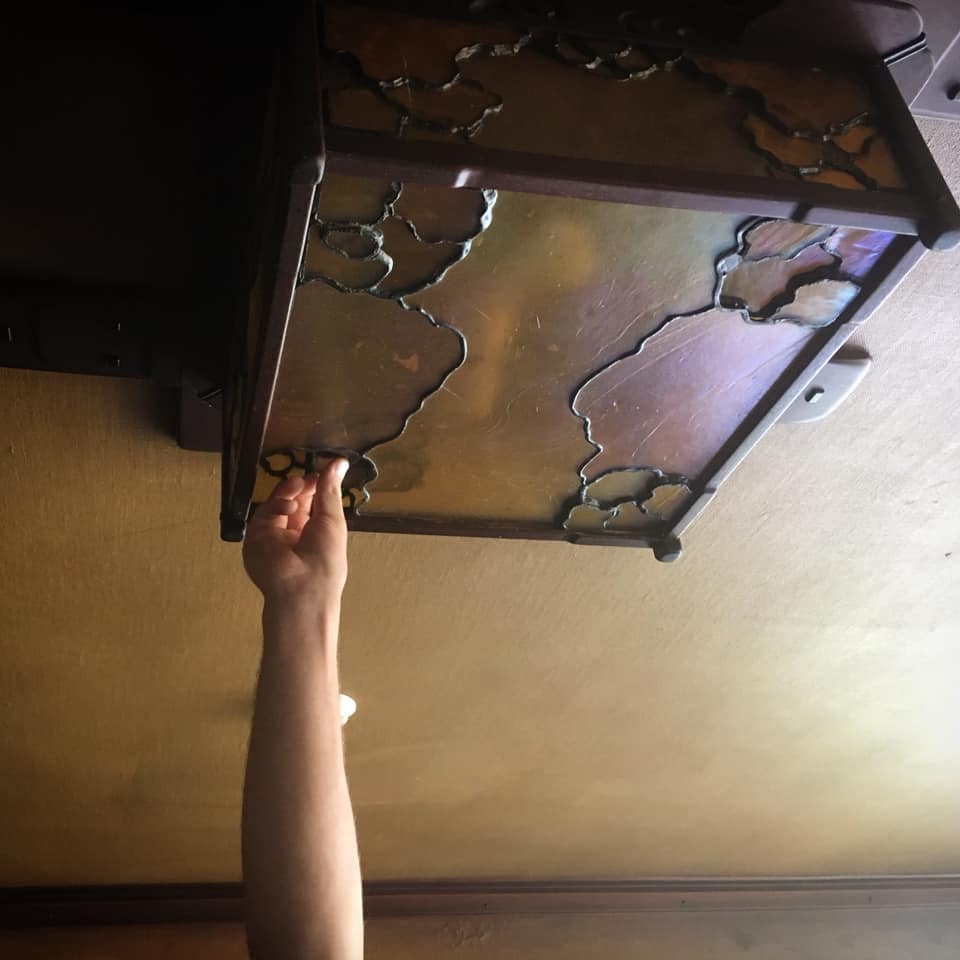 Thorsen House dining room ceiling fixture with ingenious hidden access panels for changing lightbulbs, cloud lift design