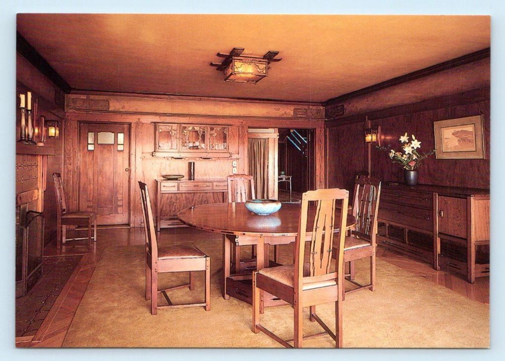 Thorsen House dining room with complete Greene & Greene furniture suite, mahogany paneling, ceiling fixture, and built-in sideboard