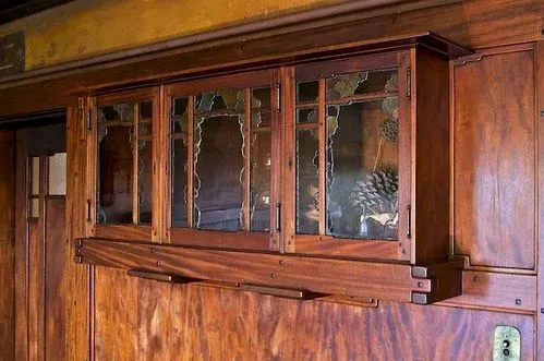 Thorsen House dining room built-in cabinet with glass doors, cloud lift art glass, and forward-looking modern design