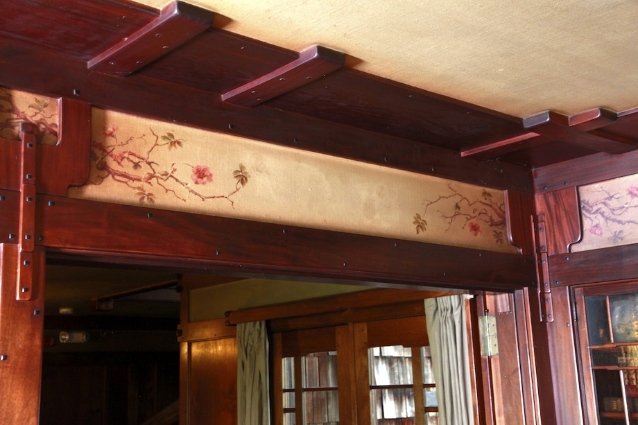 Expanded view of Charles Greene hand-painted frieze in Thorsen House living room with trailing roses and foliage motifs