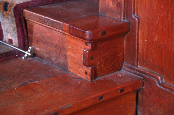 Detail of Thorsen House stairway risers showing stepped construction, ebony pegs, and mahogany joinery details