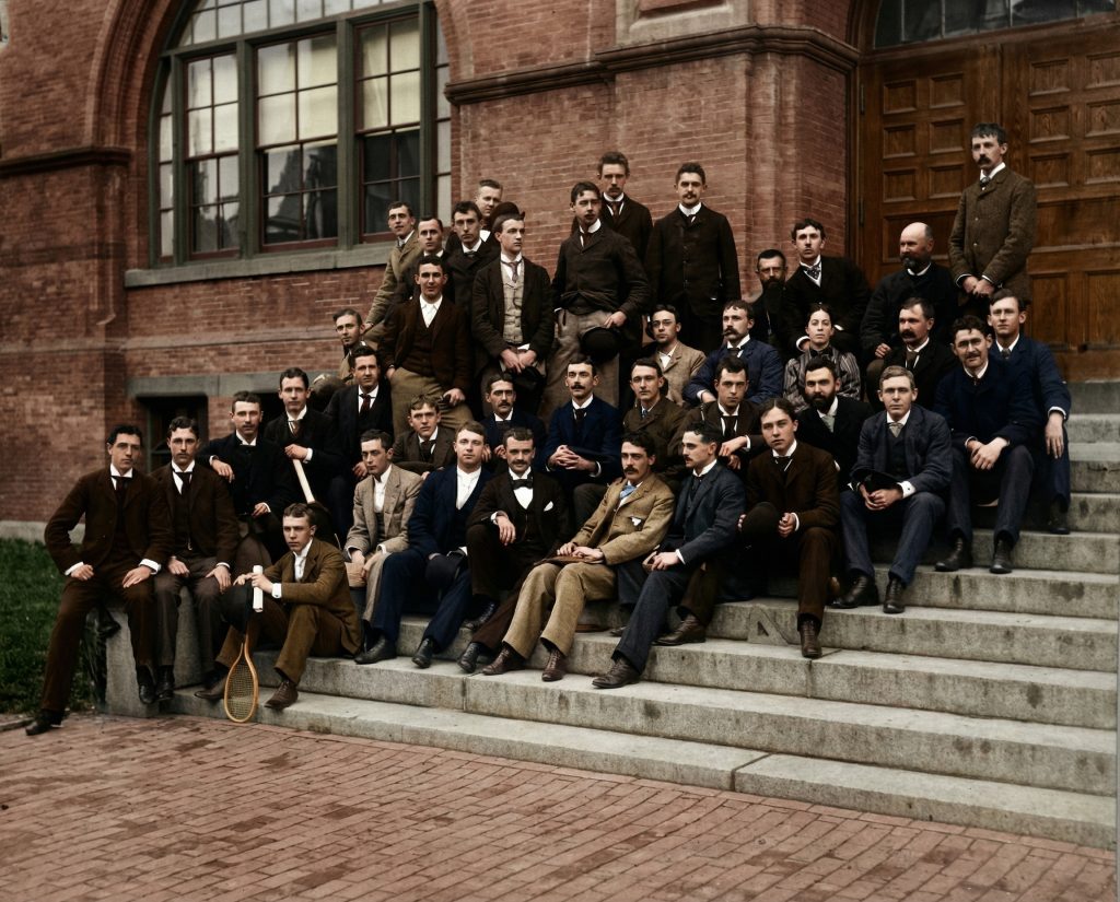 Sepia-toned historical photograph of MIT graduating class with Charles and Henry Greene, circa late 1800s.