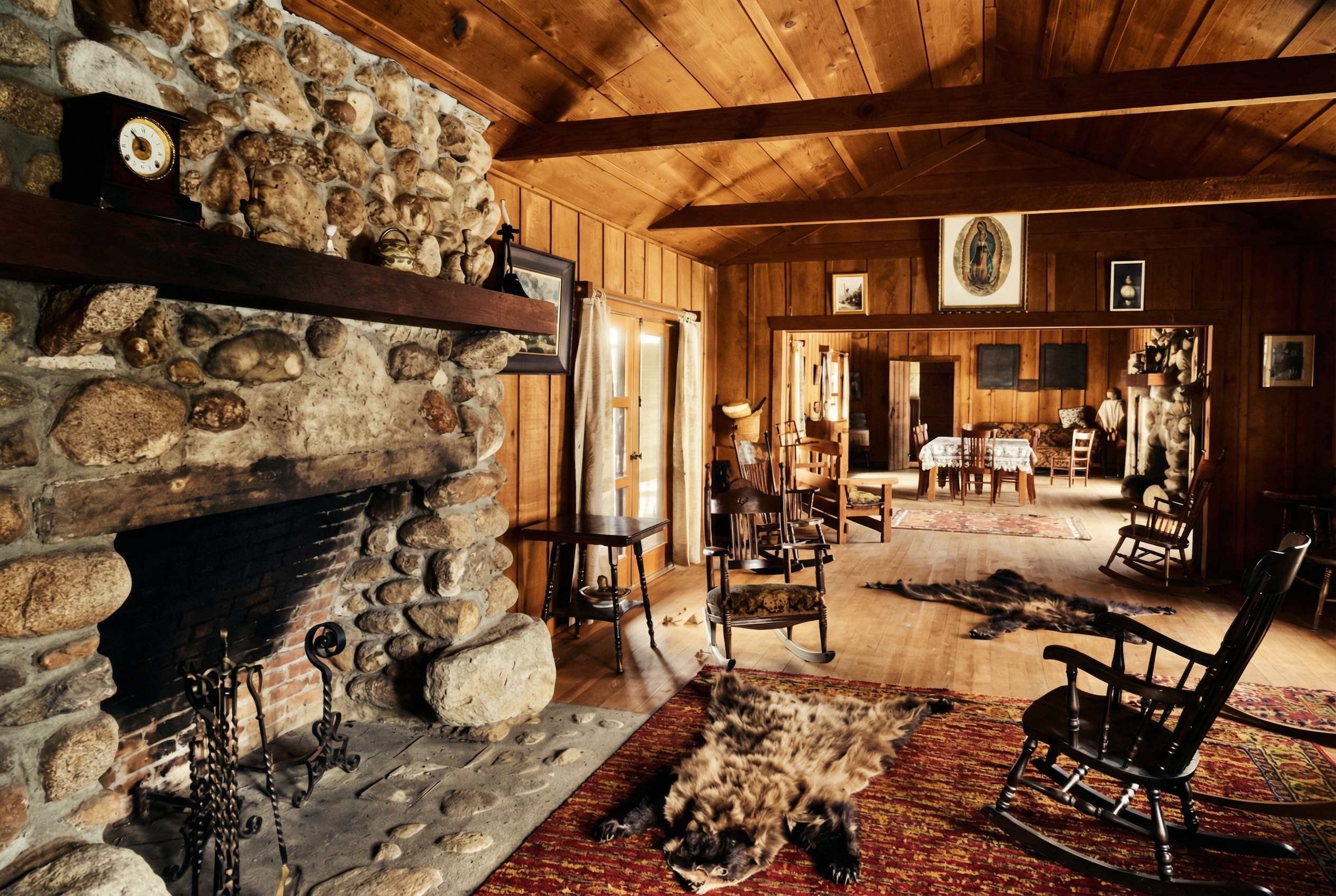 Interior room with exposed wooden ceiling beams and a plain stone fireplace; historic photograph, colorized.