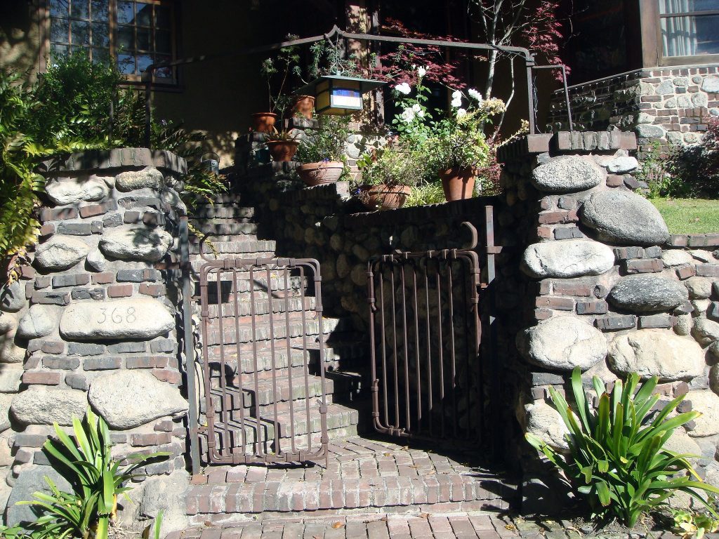 Entrance gate to Charles S. Greene House property displaying Greene & Greene's attention to landscape integration