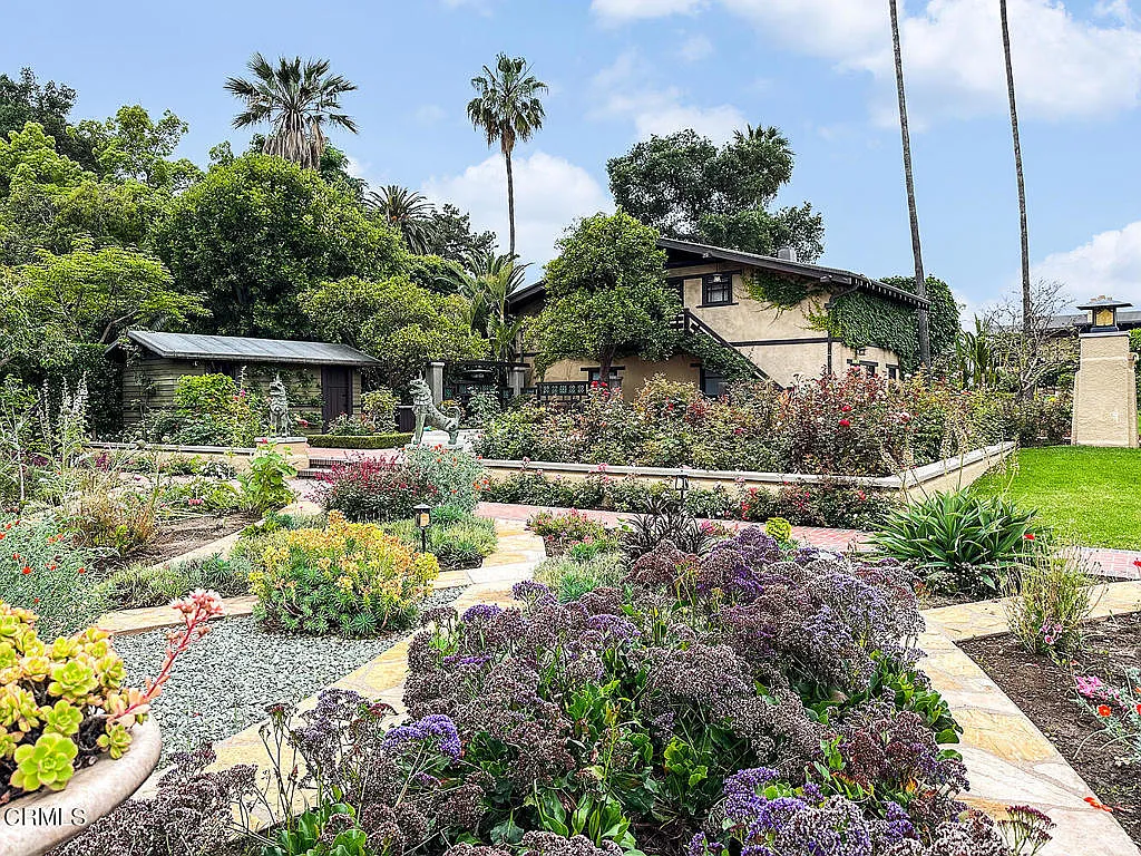 Terraced garden at the Laurabelle A. Robinson House with native plantings, stone retaining walls, and canyon overlook