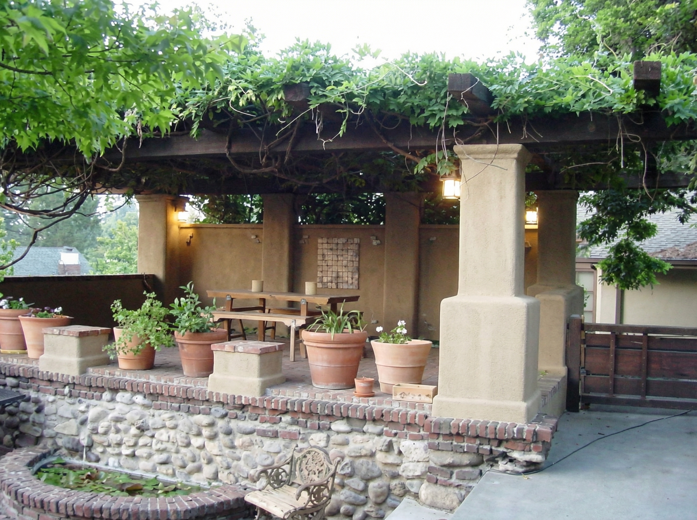 Wisteria-covered pergola at Charles S. Greene House garage, completed in 1998 from original 1914 sketches