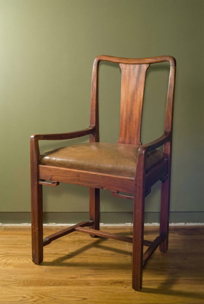 Dining room chair from the Laurabelle A. Robinson House with mahogany frame, leather seat, and Asian-inspired back splat