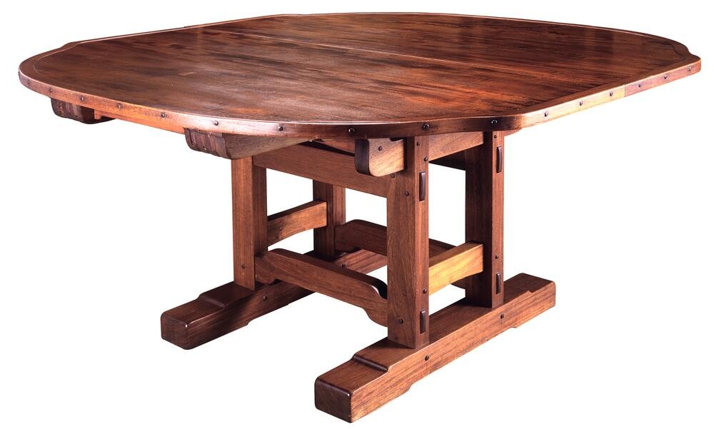 Dining table from the Laurabelle A. Robinson House with trestle base, copper edge banding, and exposed joinery details
