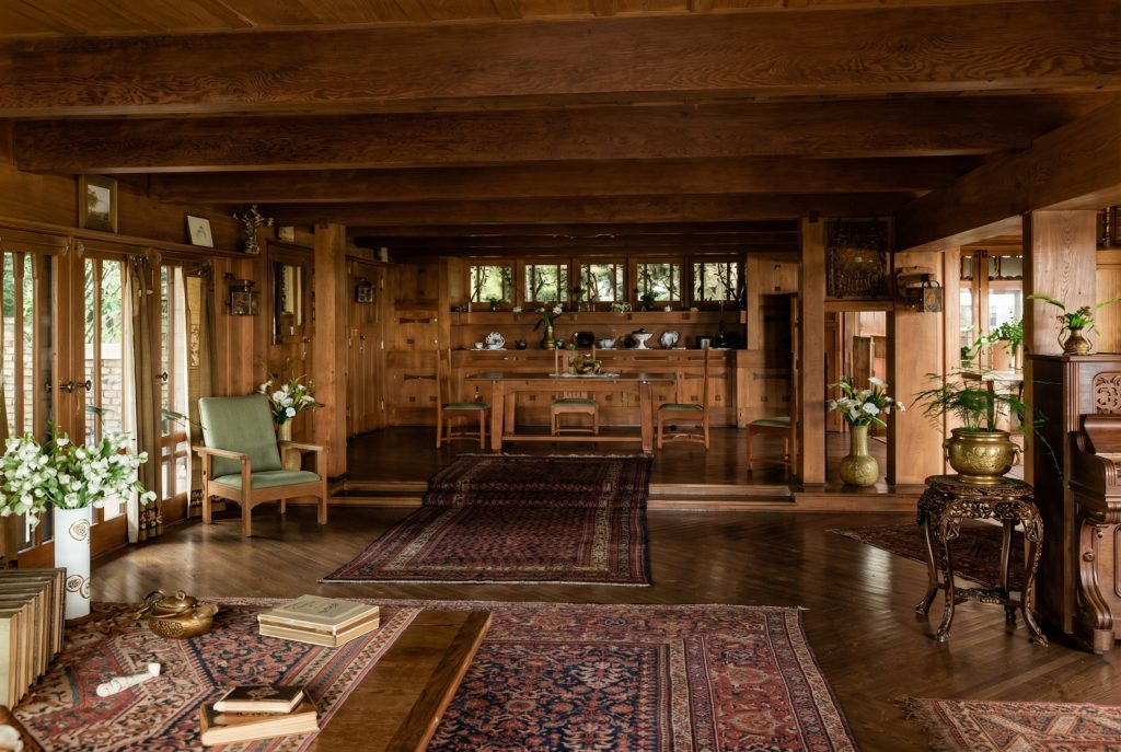 Historic colorized interior photograph showing living room and raised dining room at Adelaide Tichenor house
