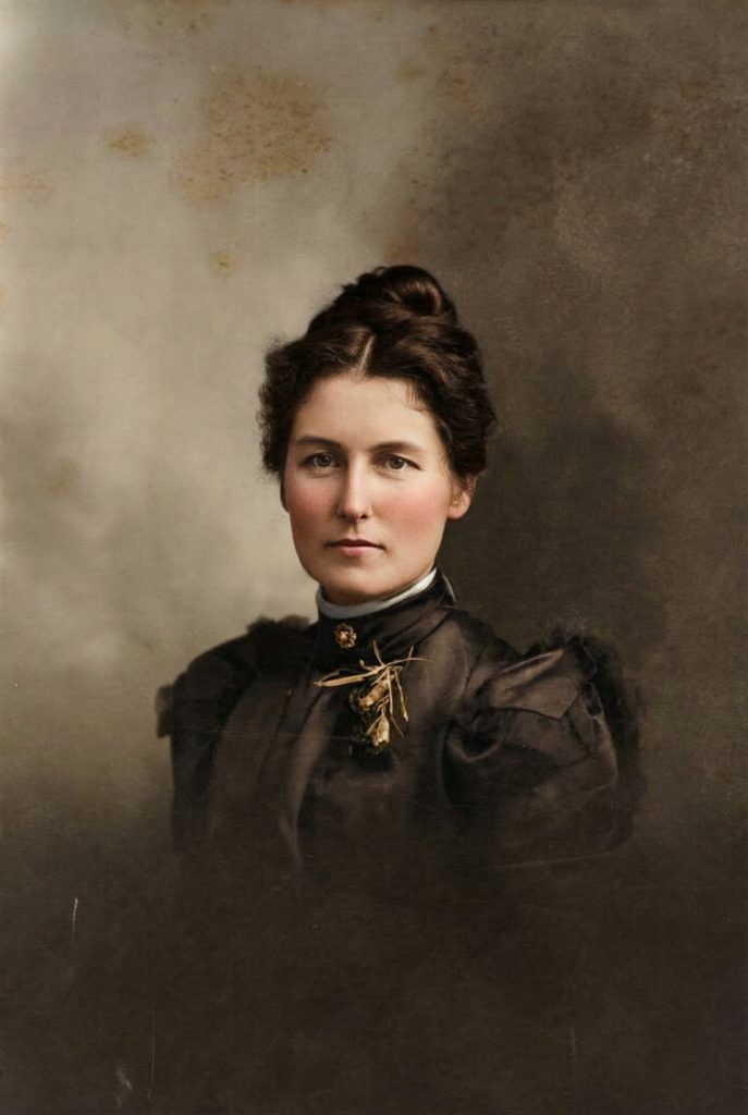 Historic colorized portrait photograph of Alice Gordon Greene, wife of architect Charles Sumner Greene