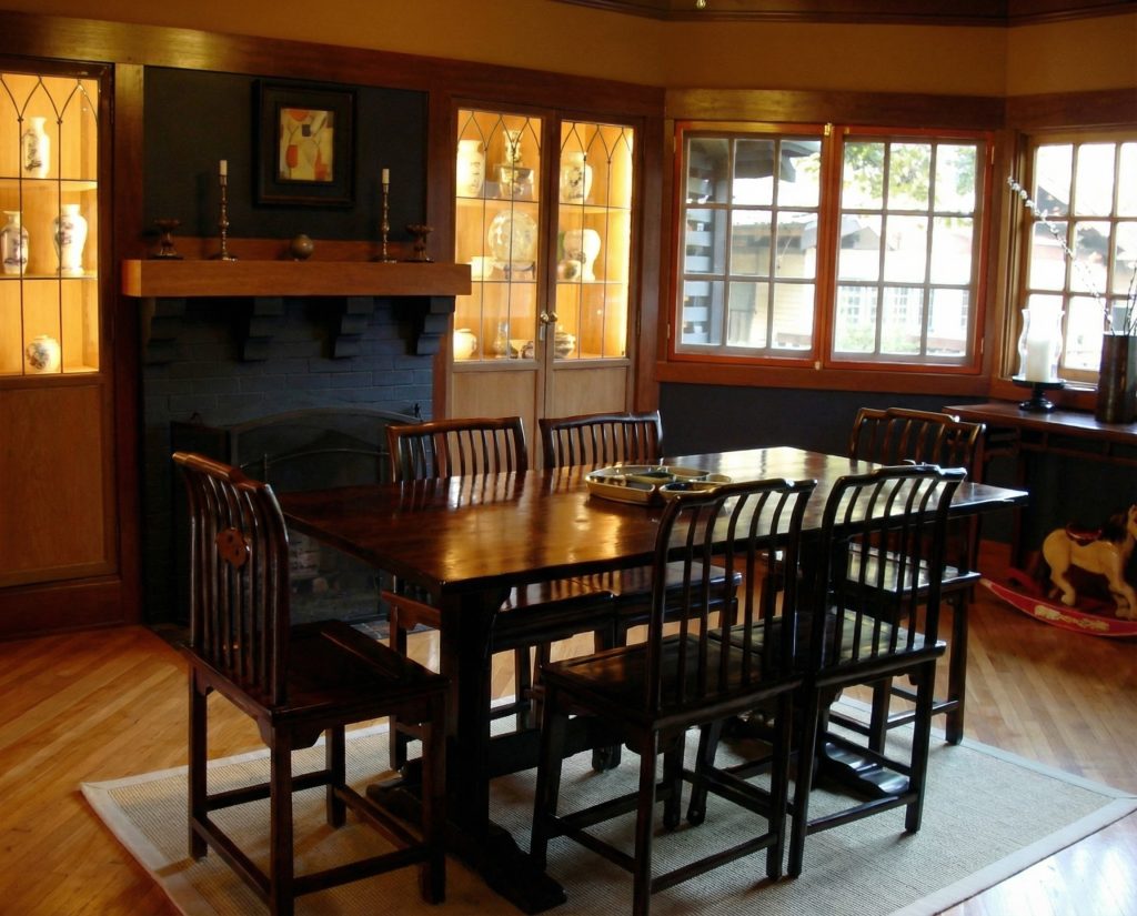 Dining room interior of Charles S. Greene House with octagonal bay window and Arts and Crafts furnishings