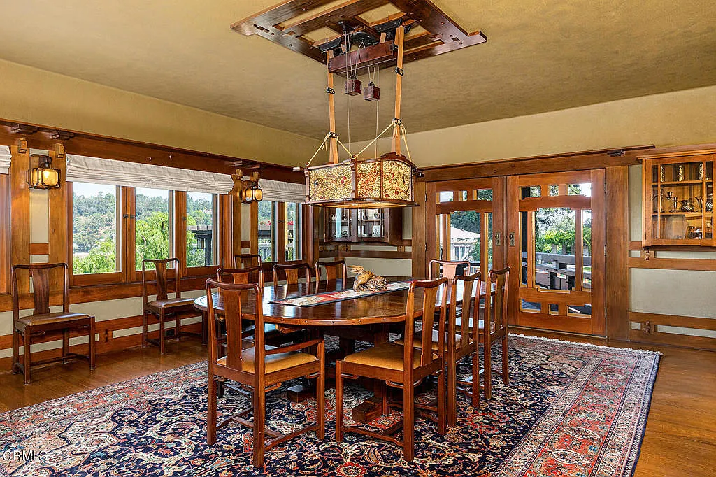 Dining room of the Laurabelle A. Robinson House with mahogany furniture, built-in sideboard, and Arts and Crafts chandelier