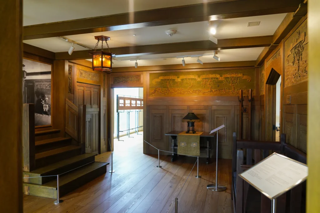 Photo of the entry hall of the James A. Culbertson house at the Museum of the American Arts and Grafts Movement.