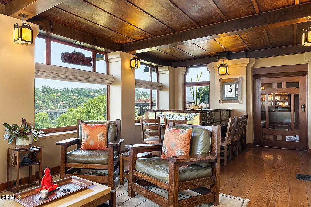 Sitting area in the Laurabelle A. Robinson House with comfortable seating, wood floors, and large canyon view windows