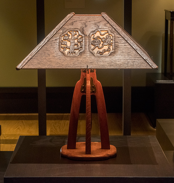 Table lamp from the Laurabelle A. Robinson House with tripod mahogany base, pyramidal shade, and carved decorative panels