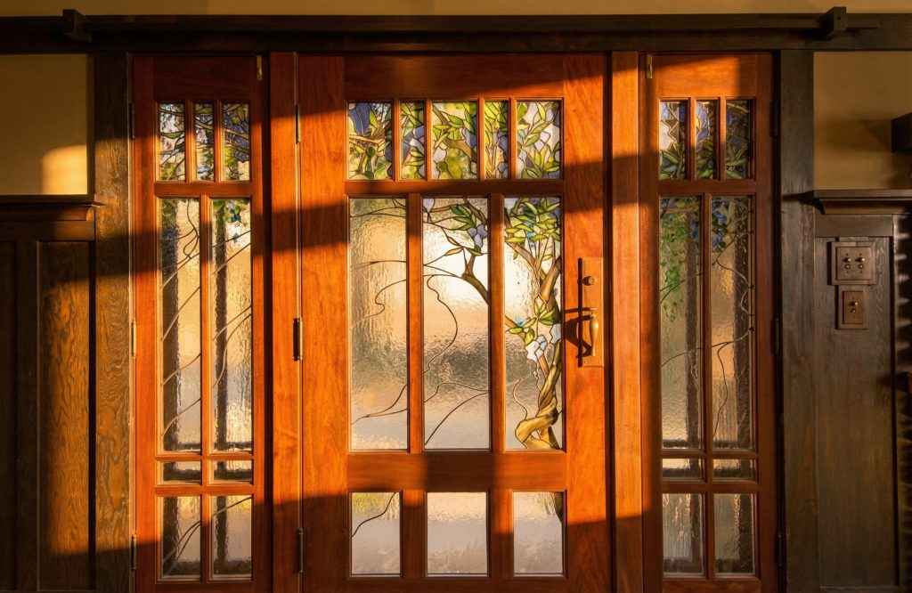 The Duncan-Irwin House art glass detail by Emil Lange featuring wisteria vine motif in luminous colors.