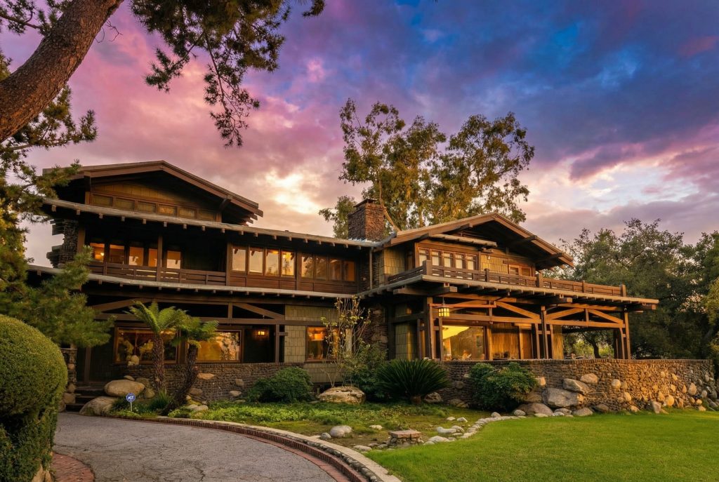 Driveway approach to The Duncan-Irwin House framed by mature landscaping and architectural details.