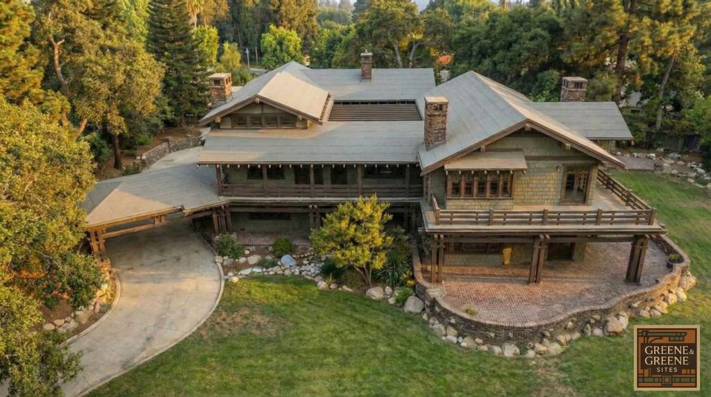 Aerial view of The Duncan-Irwin House driveway at golden hour, showcasing Arts and Crafts architecture.