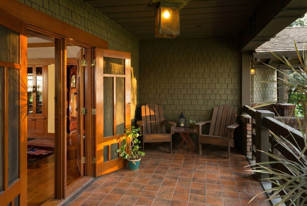 Covered terrace at The Dr. William T. Bolton House #3 featuring exposed timber beams and outdoor living area.