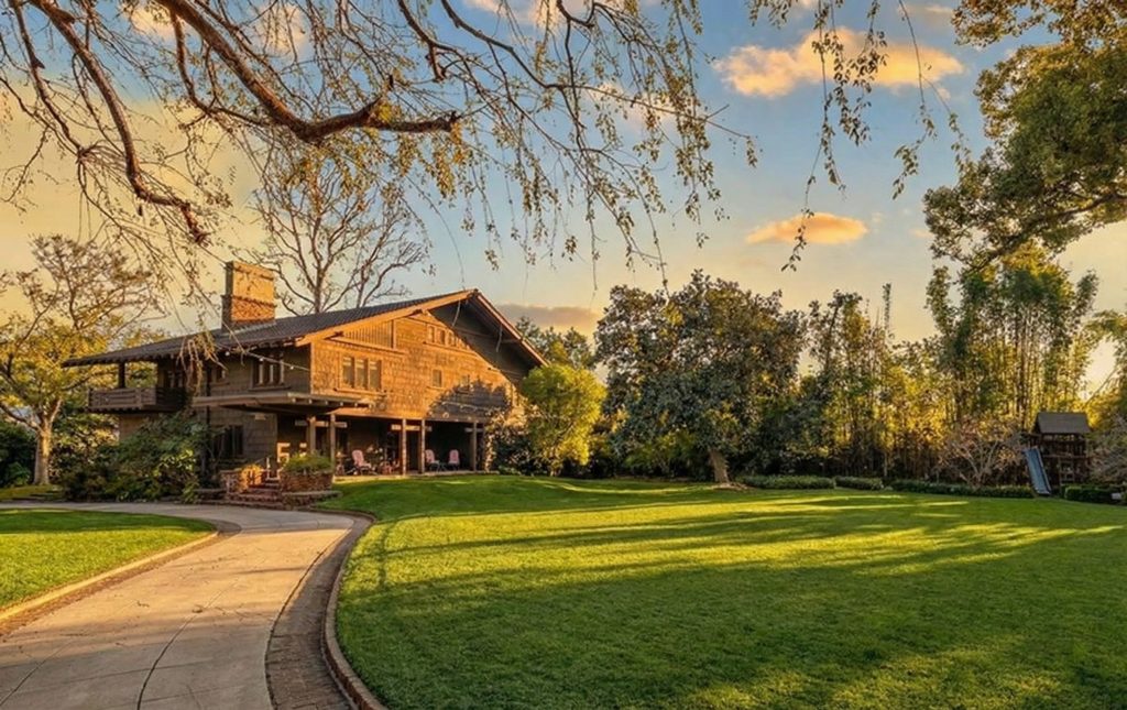 Driveway approach with mature landscaping and Arts and Crafts details at The Margaret B. S. Clapham Spinks House.